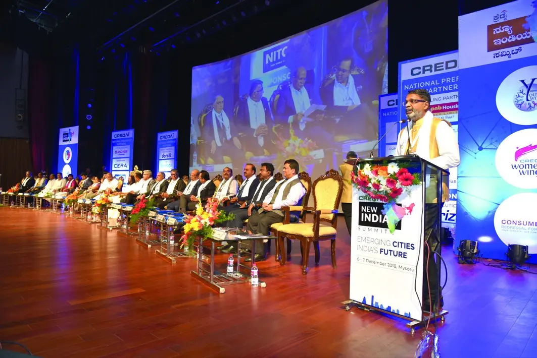Corporate summit stage with a large branded LED backdrop